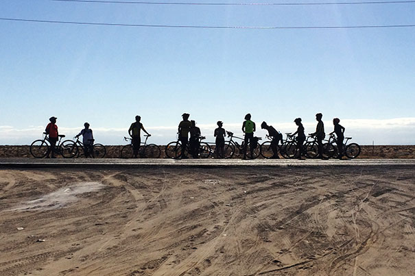 This photo was taken around mile 800, on the most rural, flat stretch of the desert. We would bike several hours and take breaks as a group to eat and hydrate and stretch. Courtesy of Michael Meo