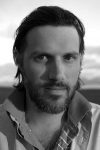 black and white headshot of Brett Culbert