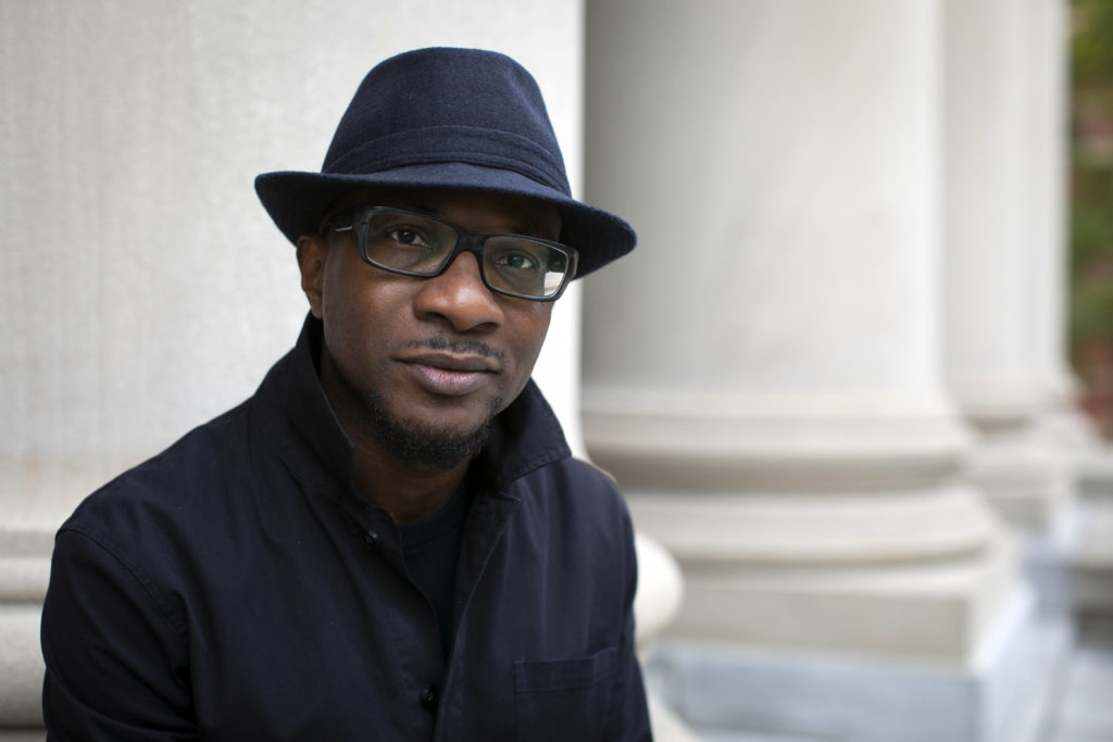 Teju Cole is the photography critic of the New York Times Magazine and the Gore Vidal Professor of the Practice of Creative Writing at Harvard. He is pictured outside Widener Library at Harvard University. Stephanie Mitchell/Harvard Staff Photographer
