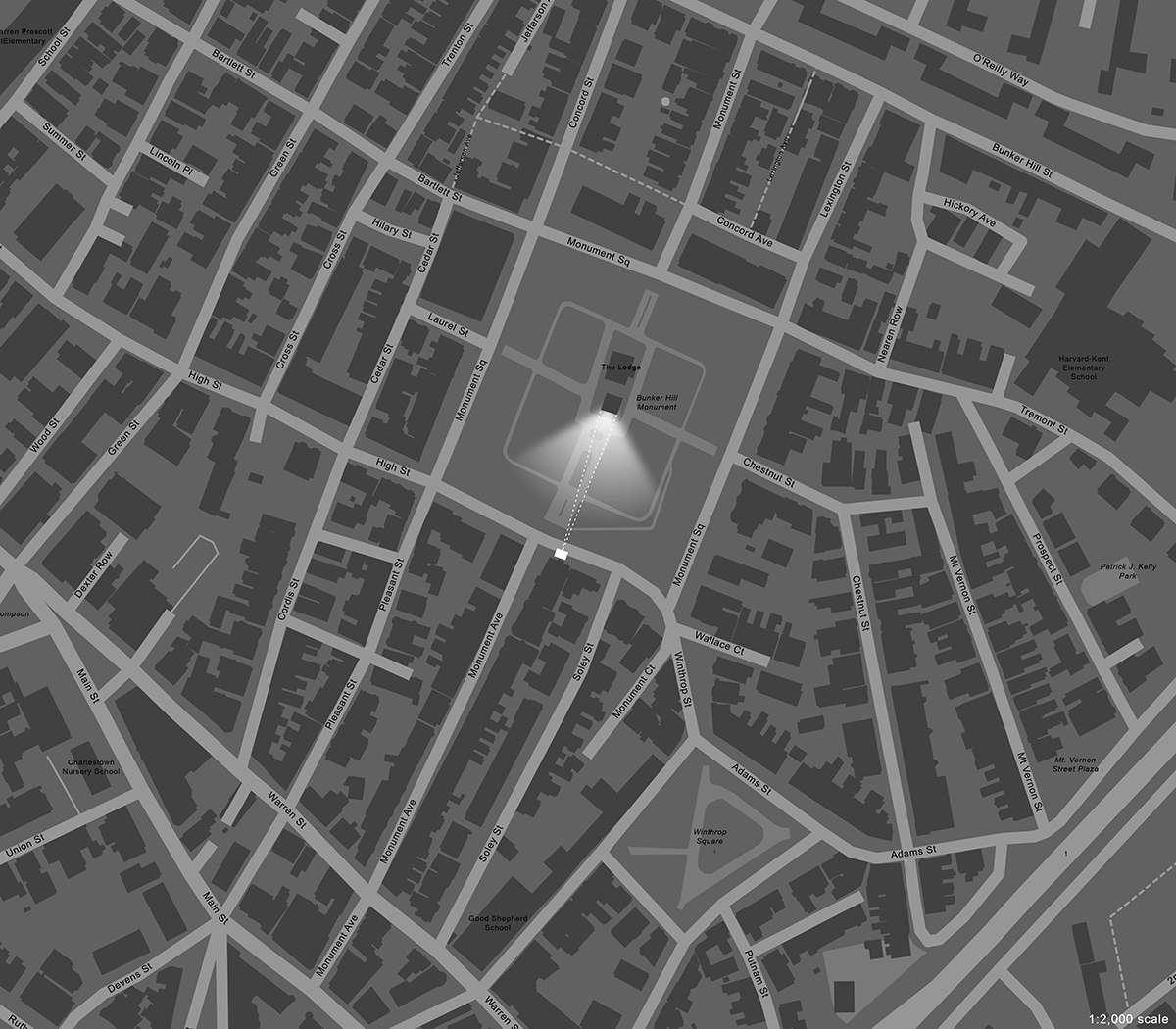 Aerial map of a section of Charlestown, Massachusetts showing Monument Square with the Bunker Hill Monument in the center. A highlighted area on the southern facade of the monument shows the location of the projection.