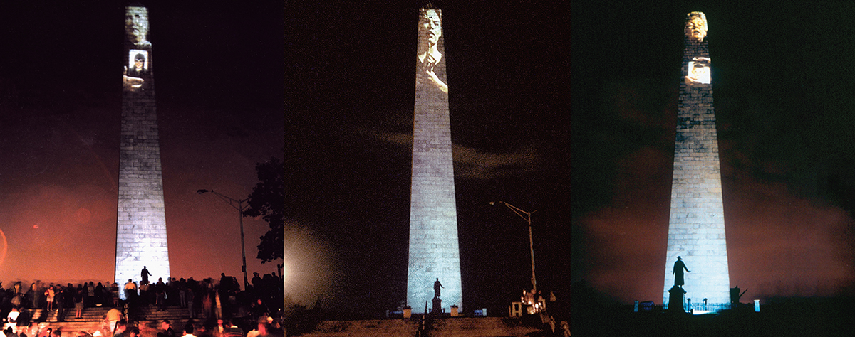 Three images of the Bunker Hill Monument at night, each showing a projection of a different person on the facade.