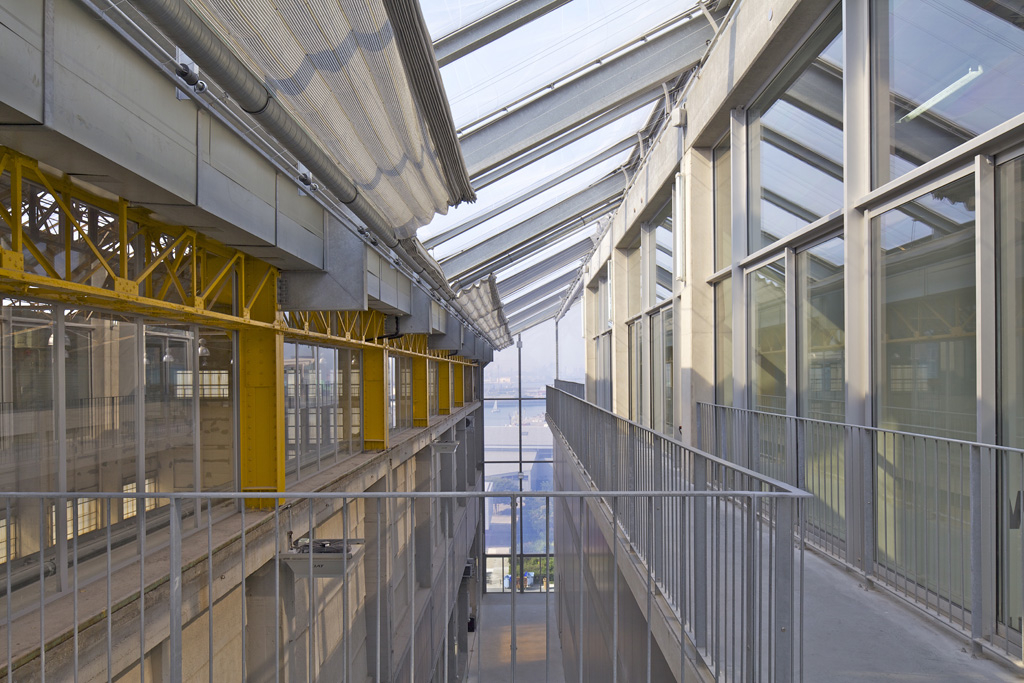 Interior of modern building with silver and yellow beams.