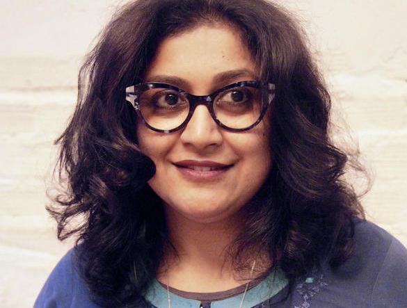 Headshot of Anooradha Iyer Siddiqi, who wears glasses.